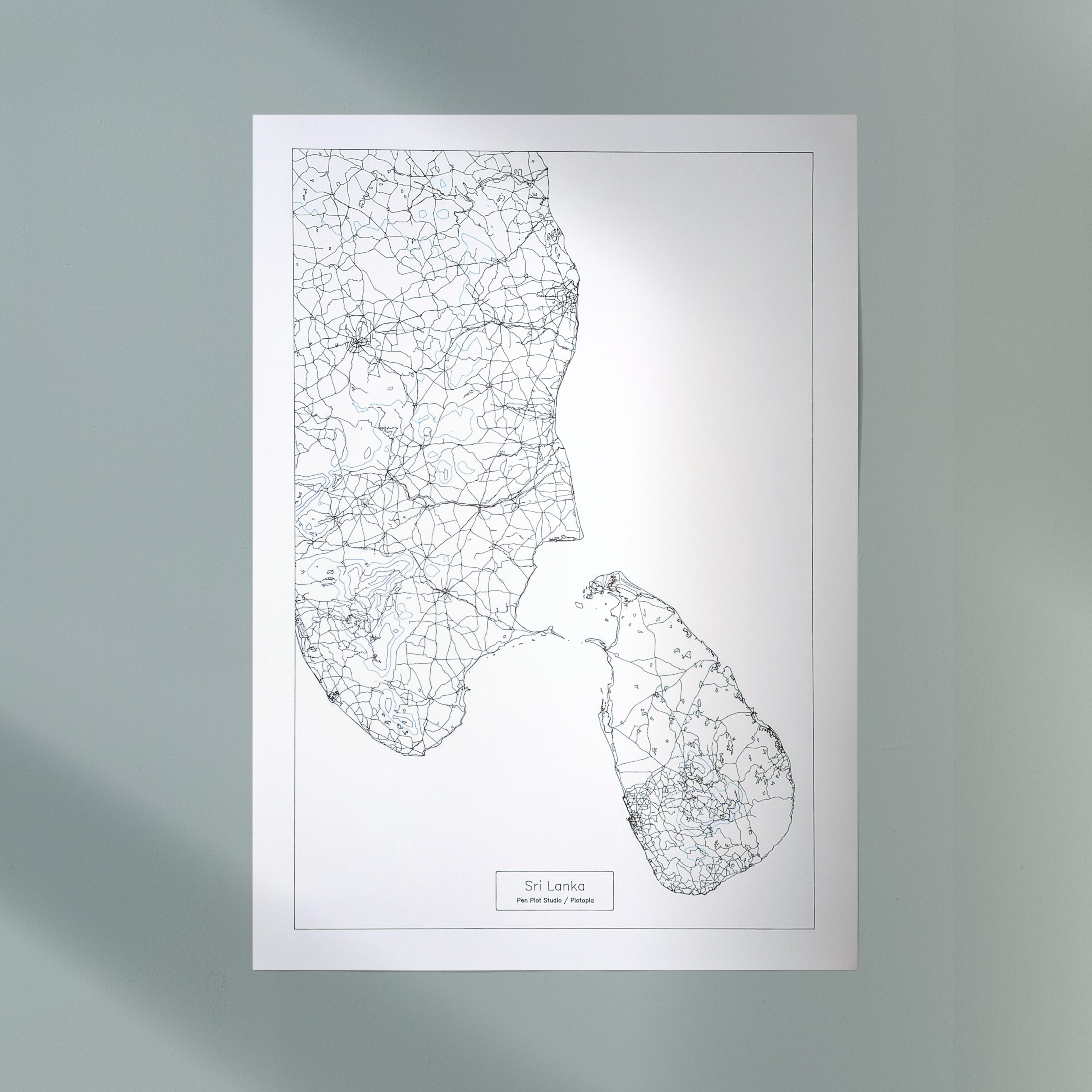 Pen plotted map of the island of Sri Lanka and southern India hanging on a wall (mock up)